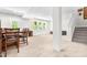Basement featuring carpet, dining table and chair set, a window and supporting column at 1709 Chestnut Falls Rd, Wendell, NC 27591