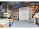 Unfinished basement with exposed ceiling and various items stored, offering potential for customization at 1709 Chestnut Falls Rd, Wendell, NC 27591