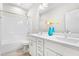 Bathroom featuring a double vanity with white cabinets, a large mirror and a shower-tub combo at 1709 Chestnut Falls Rd, Wendell, NC 27591