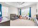 Cozy ' bedroom featuring large windows, plush toys, and comfortable sleeping arrangement at 1709 Chestnut Falls Rd, Wendell, NC 27591