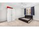 Bedroom featuring a bed frame, window, closet, and fan; offering comfort and functionality at 1709 Chestnut Falls Rd, Wendell, NC 27591