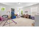 Spacious bonus room with large windows, built-in shelving, and ample space for activities and storage at 1709 Chestnut Falls Rd, Wendell, NC 27591