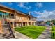 Community clubhouse featuring stone accents, outdoor lounge, and proximity to the pool and amenities at 1709 Chestnut Falls Rd, Wendell, NC 27591