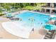 Community pool featuring zero entry, splash features, and ample lounge seating for residents at 1709 Chestnut Falls Rd, Wendell, NC 27591