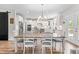 Charming dining area adjacent to the kitchen, featuring a stylish table with seating for six at 1709 Chestnut Falls Rd, Wendell, NC 27591