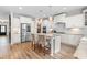 Modern kitchen with an island, stainless steel appliances, and ample cabinet space, perfect for cooking at 1709 Chestnut Falls Rd, Wendell, NC 27591