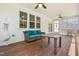 Relaxing screened-in porch with comfortable seating, wood flooring, and a serene outdoor view at 1709 Chestnut Falls Rd, Wendell, NC 27591