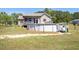 Spacious backyard with a deck, an above-ground pool, and a lush green lawn at 187 Old Johnson Rd, Wendell, NC 27591