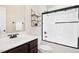 Bathroom featuring a shower-over-tub and a modern vanity with dark wood cabinetry and white sink at 187 Old Johnson Rd, Wendell, NC 27591