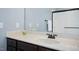Bathroom features a marble countertop, a dark wood cabinet and a decorative mirror at 187 Old Johnson Rd, Wendell, NC 27591