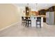 Open concept kitchen features granite counters, stainless steel appliances, and seating at the bar at 187 Old Johnson Rd, Wendell, NC 27591