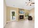 Cozy living room with a stone fireplace, vaulted ceilings, and modern flooring, with great natural light at 187 Old Johnson Rd, Wendell, NC 27591