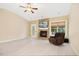 Bright living room featuring a fireplace, ceiling fan, and neutral-toned walls, enhancing its cozy atmosphere at 187 Old Johnson Rd, Wendell, NC 27591