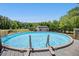 Above-ground swimming pool surrounded by a wooden deck and a fenced yard with a shed at 187 Old Johnson Rd, Wendell, NC 27591