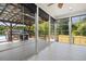 A bright sunroom that opens onto a deck with a grill, with backyard views at 187 Old Johnson Rd, Wendell, NC 27591