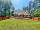 Expansive backyard with a multi-tiered deck, perfect for outdoor gatherings and relaxation at 19 Rivers Edge Ct, Timberlake, NC 27583