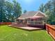 Multi-level deck with outdoor furniture and umbrellas, perfect for backyard relaxation at 19 Rivers Edge Ct, Timberlake, NC 27583
