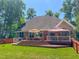 Backyard showcasing the deck with outdoor furniture, creating an inviting space for entertaining at 19 Rivers Edge Ct, Timberlake, NC 27583