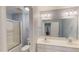 Well-lit bathroom with a double sink, shower and toilet, featuring a large vanity mirror at 19 Rivers Edge Ct, Timberlake, NC 27583