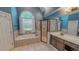 Bright bathroom featuring a glass enclosed shower and an arched window above the tub at 19 Rivers Edge Ct, Timberlake, NC 27583