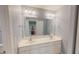 Bathroom with a double vanity sink, a large mirror, and nautical decor in the background at 19 Rivers Edge Ct, Timberlake, NC 27583