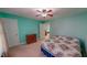 Inviting bedroom featuring a colorful palette, ceiling fan, and doorway view to another room at 19 Rivers Edge Ct, Timberlake, NC 27583