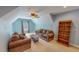 Comfortable bonus room with ceiling fan, two couches and a bookcase at 19 Rivers Edge Ct, Timberlake, NC 27583