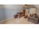 Spacious bonus room with 2 sofas, a bookcase, and neutral colored carpet at 19 Rivers Edge Ct, Timberlake, NC 27583