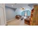 Upstairs bonus room with two couches, bookcase and natural light at 19 Rivers Edge Ct, Timberlake, NC 27583