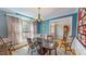 Bright dining room with hardwood floors, large windows, and traditional furniture at 19 Rivers Edge Ct, Timberlake, NC 27583