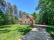 Traditional brick home with a well-manicured lawn and driveway at 19 Rivers Edge Ct, Timberlake, NC 27583