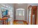Inviting foyer featuring hardwood floors, a grand staircase, and ample natural light at 19 Rivers Edge Ct, Timberlake, NC 27583