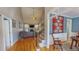 Inviting foyer with hardwood floors, staircase, and a view of the living room fireplace at 19 Rivers Edge Ct, Timberlake, NC 27583