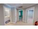 Hallway with access to the bathroom and bedroom, which features neutral-toned walls and carpet at 19 Rivers Edge Ct, Timberlake, NC 27583