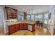 Eat-in kitchen with wooden cabinetry, granite countertops, and stainless steel appliances at 19 Rivers Edge Ct, Timberlake, NC 27583