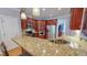 Well-equipped kitchen featuring stainless steel appliances, wood cabinets, and granite countertops at 19 Rivers Edge Ct, Timberlake, NC 27583