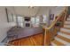 Inviting living room with fireplace, hardwood floors, and staircase in a well-lit space at 19 Rivers Edge Ct, Timberlake, NC 27583
