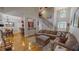 Spacious living room with hardwood floors, fireplace, and staircase at 19 Rivers Edge Ct, Timberlake, NC 27583