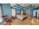 Spacious main bedroom boasts stylish tray ceilings, fan, and adjacent ensuite bathroom at 19 Rivers Edge Ct, Timberlake, NC 27583