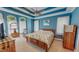 The main bedroom features high ceilings with fan, and matching dresser and night stands at 19 Rivers Edge Ct, Timberlake, NC 27583