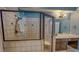 Bathroom shower enclosure features tiled walls and a glass door for a modern look at 19 Rivers Edge Ct, Timberlake, NC 27583