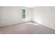 Bright bedroom with soft carpet, neutral walls, and a window providing natural light at 1909 Redding Lane, Durham, NC 27712