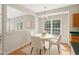 Cozy dining area features natural light, a pendant light, and seating for four at 1909 Redding Lane, Durham, NC 27712