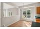 Bright dining area features hardwood floors, and a large window at 1909 Redding Lane, Durham, NC 27712