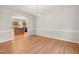 Open dining room showcases hardwood floors, chandelier, and view into the kitchen at 1909 Redding Lane, Durham, NC 27712
