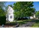 Exterior shows a manicured lawn and landscaping around this cozy home at 1909 Redding Lane, Durham, NC 27712
