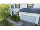 Beautiful two-story home featuring a two-car garage, landscaped yard and a brick walkway at 1909 Redding Lane, Durham, NC 27712
