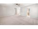 Open living room with neutral carpet, showcasing seamless flow and access to the bathroom at 1909 Redding Lane, Durham, NC 27712
