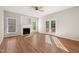Spacious living room boasts hardwood floors, a fireplace, and natural light at 1909 Redding Lane, Durham, NC 27712