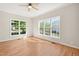 Sun-drenched room with hardwood floors and large windows overlooking the neighborhood at 1909 Redding Lane, Durham, NC 27712